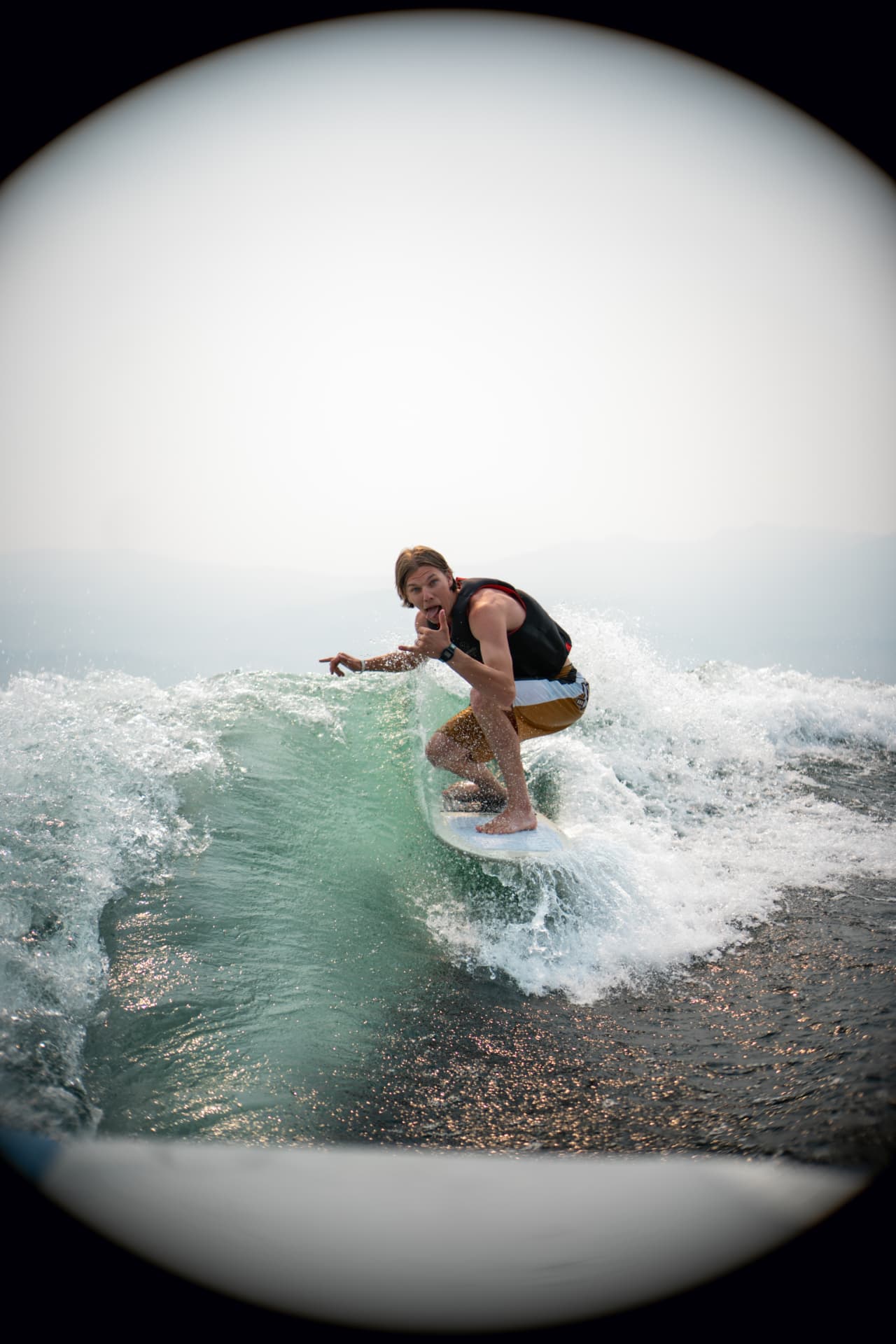 Owen wakesurfing behind a boat