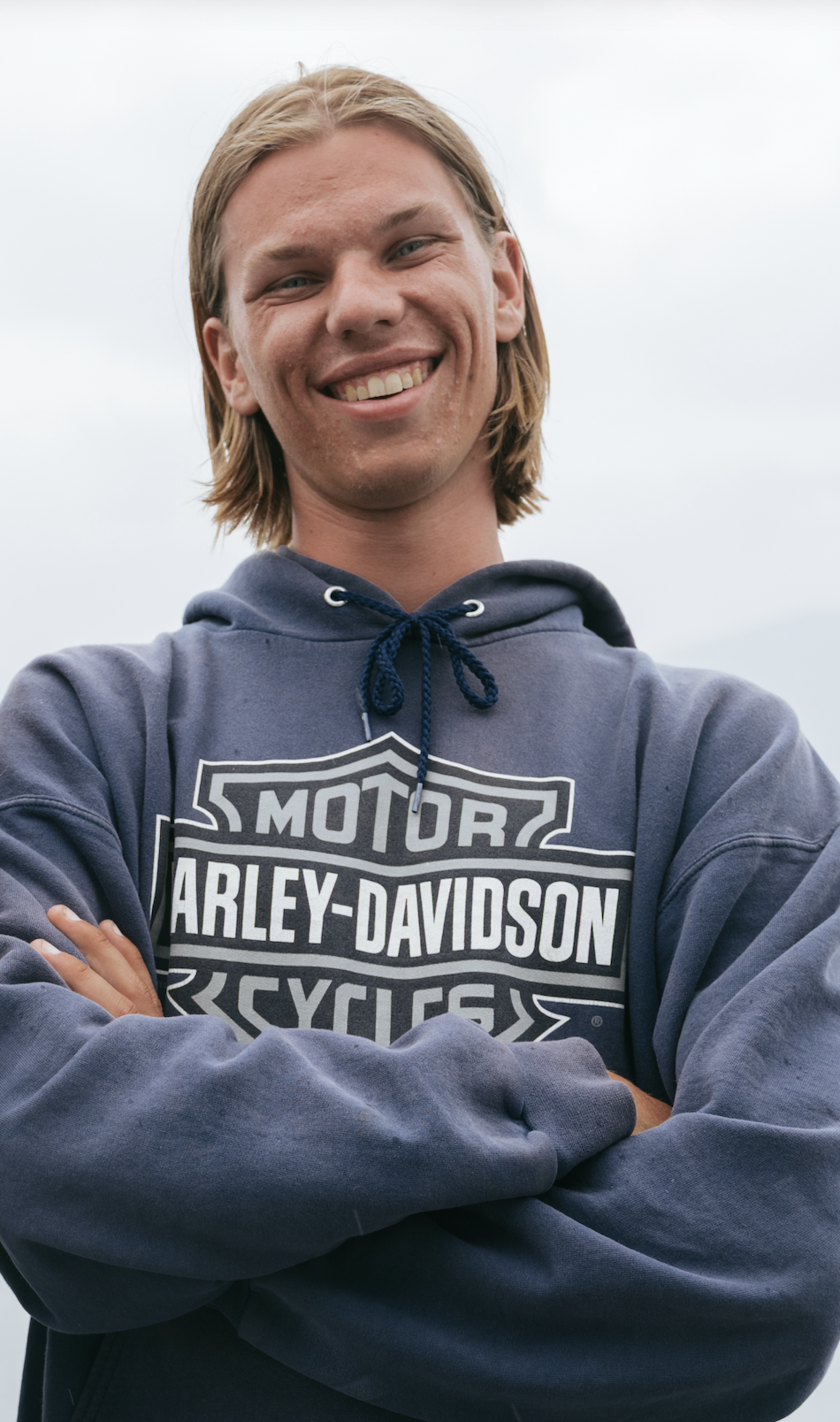 Owen Dubbeldam, arms crossed, smiling outdoors
